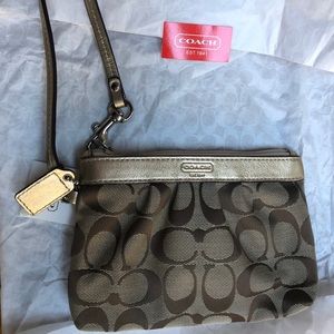 Coach with gold wristlet